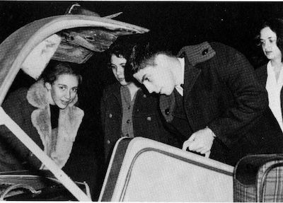 Jack Chapman, one of 14 Grinnell students  going to Washington, D.C., to demonstrate against the resumption of nuclear testing in the atmosphere by the United States, prepares for the long journey eastward. Looking on are Celia Chorosh, Mary Lou Beaman and Mary Mitchell. Page 38 1962 Cyclone